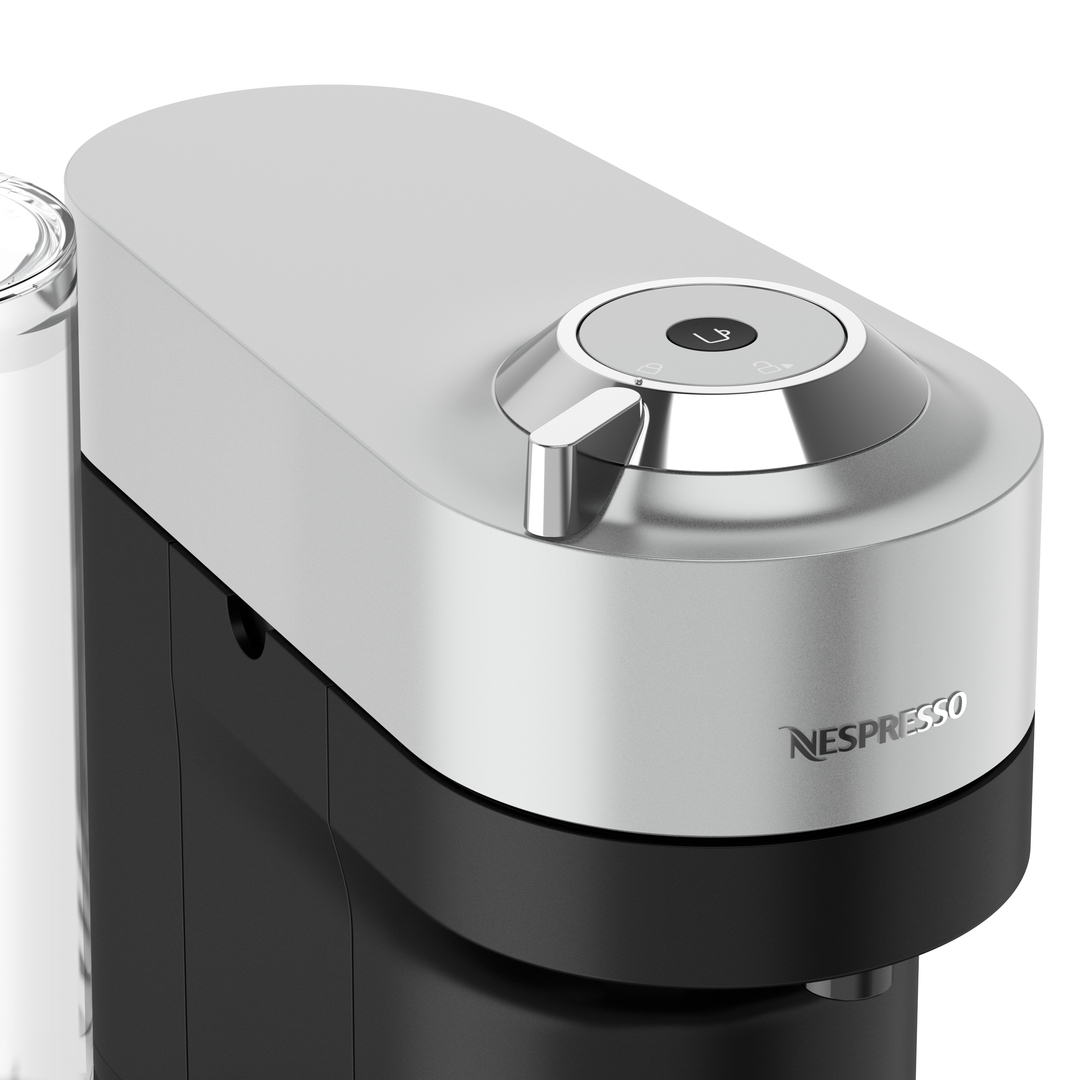 Eine silberne und schwarze Nespresso Vertuo Kaffeemaschine.