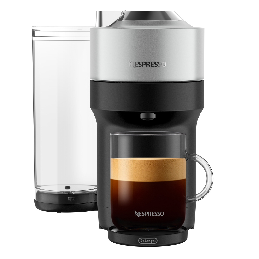 Espressomaschine mit einer Glastasse Kaffee und Wasserbehälter.