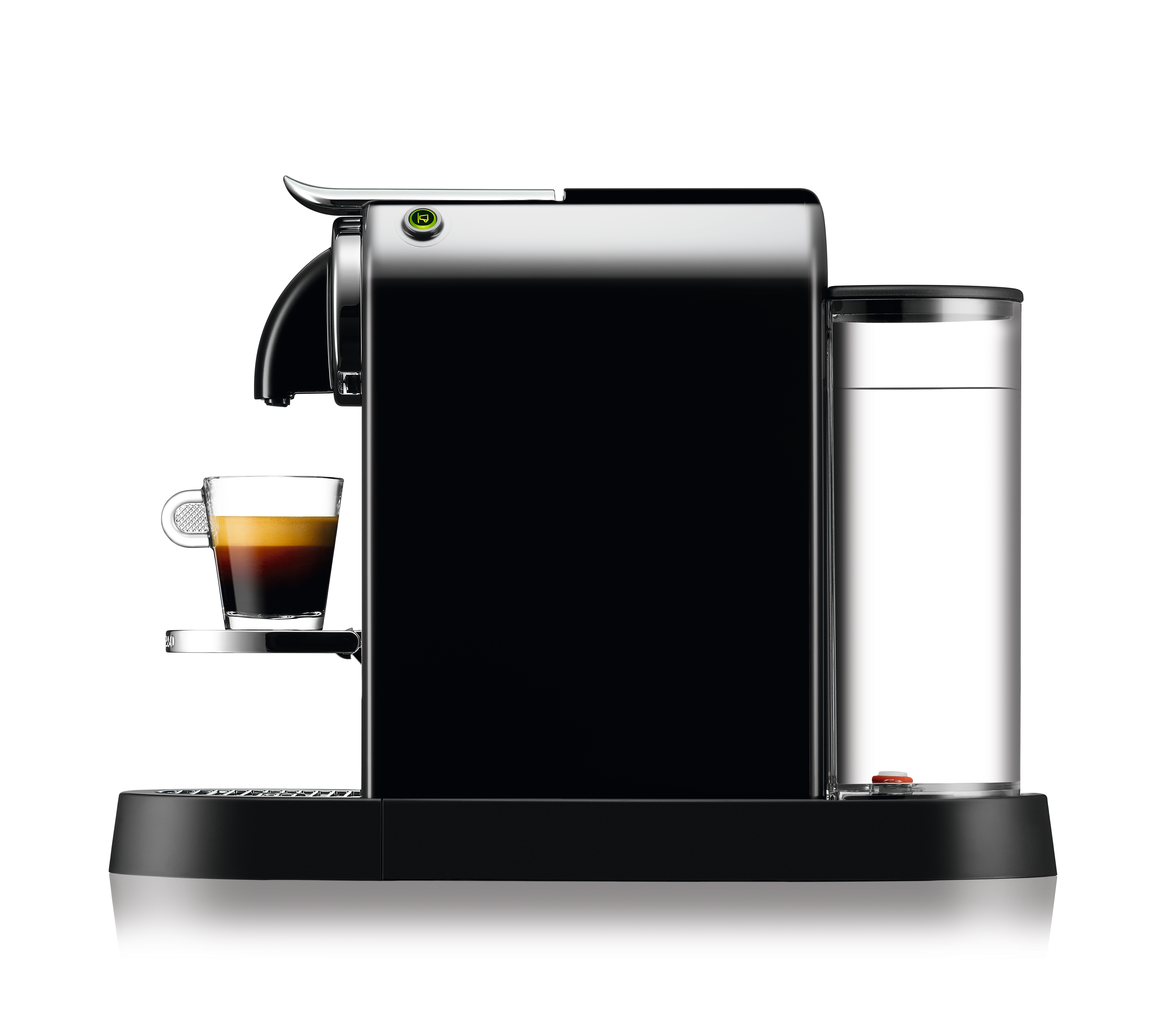 A black and silver Nespresso machine with a glass cup of coffee on a tray.