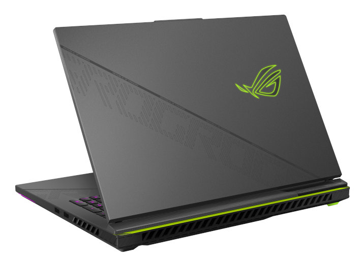 Laptop, otwarty pod kątem, pokazujący logo, z zielonymi akcentami.
