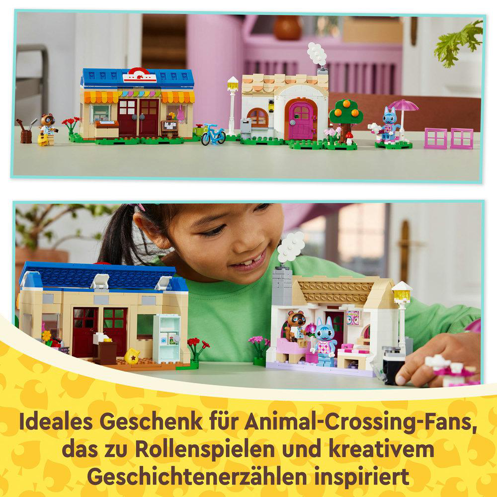 Ein Kind spielt mit einem Lego-Set, mit einer Darstellung von Lego-Häusern und Figuren.