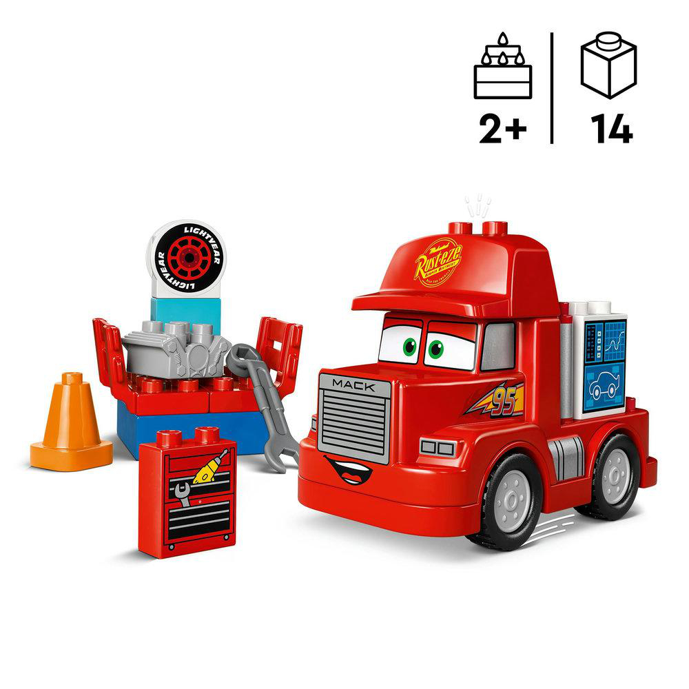 Rotes Mack-Truck-Lego-Set mit Werkzeugen und einem Autoreifen. Weißer Hintergrund.