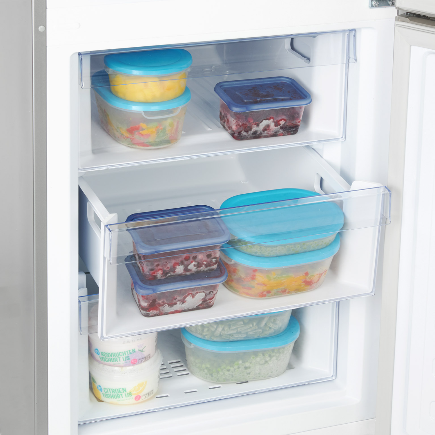 Refrigerator with open door. Inside are food containers with food. There are drawers and shelves.