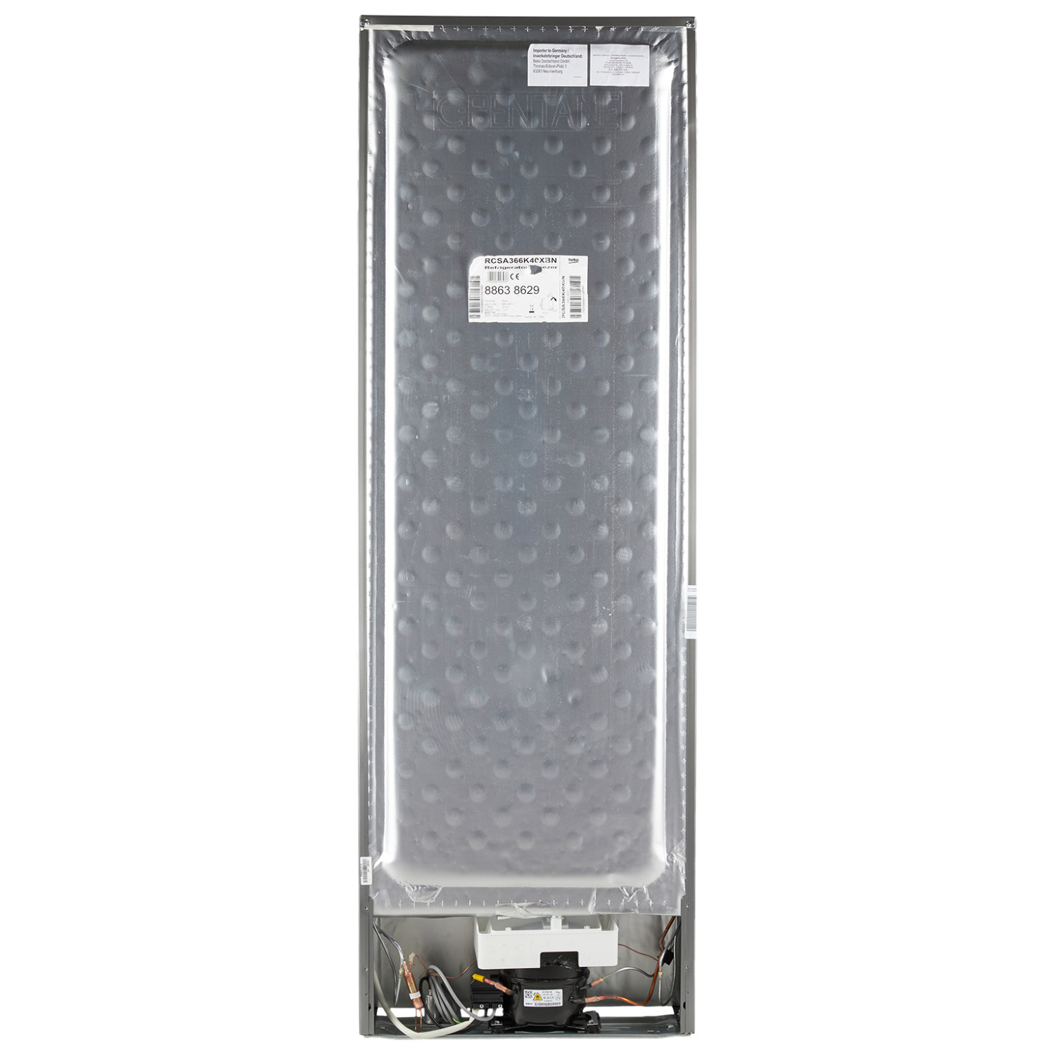Rear view of a refrigerator, showing the back panel with technical details and a black compressor.