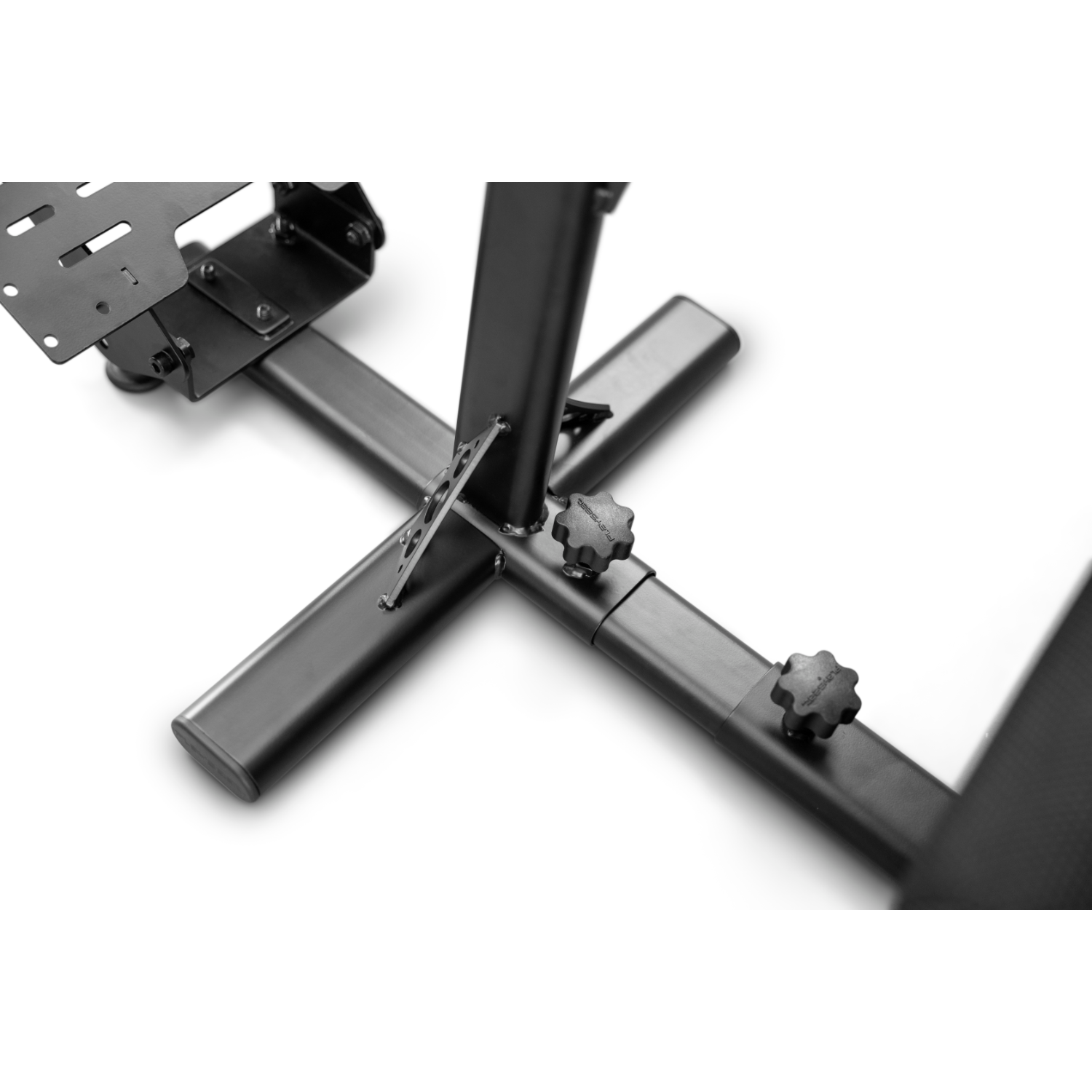Close-up of a black racing simulator stand base with adjustment knobs.