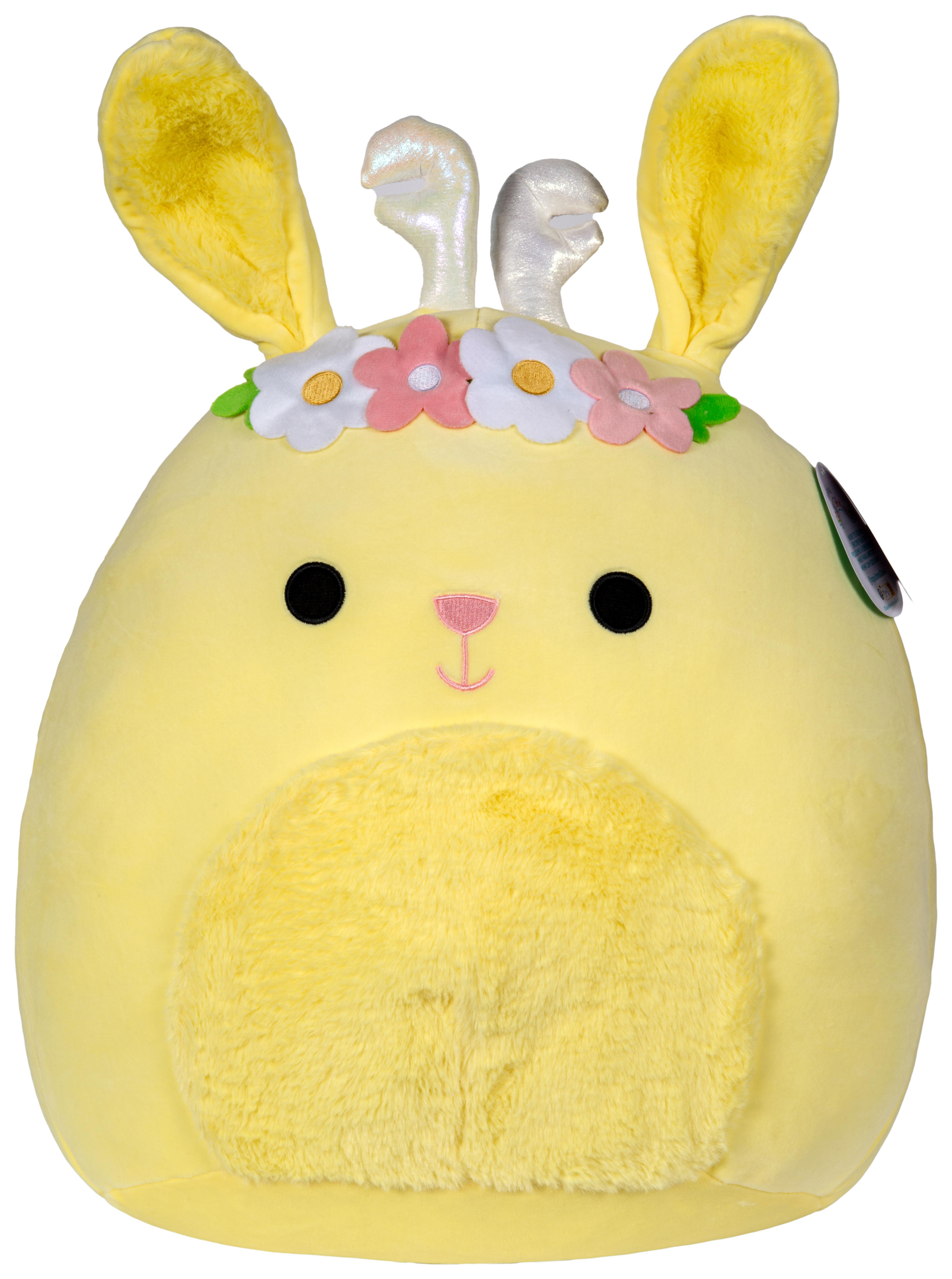 Ein Plüsch-Hase, gelber Körper, Blumengirlande und zwei silberne Geweihe.