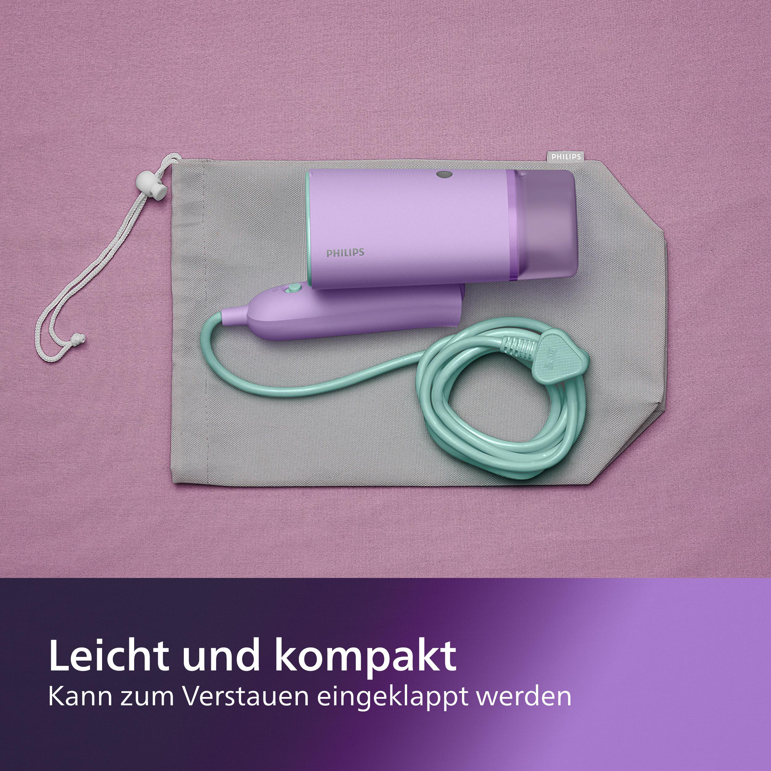 Ein lila Philips Haarentferner und Zubehör in einer grauen Tasche auf rosa Oberfläche.