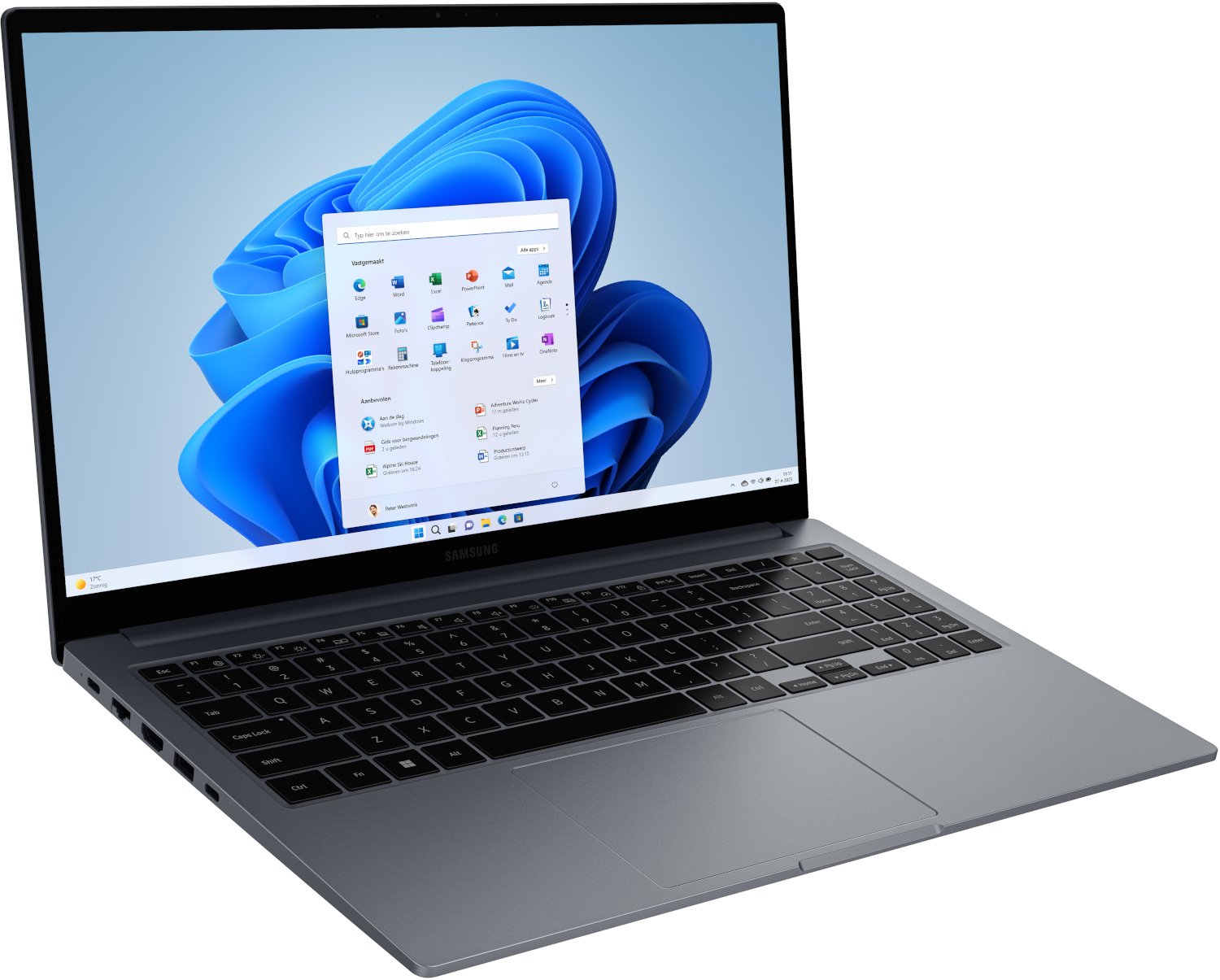 Un ordinateur portable Samsung gris ouvert, affichant le menu Démarrer de Windows 11. Le clavier est mis au point.