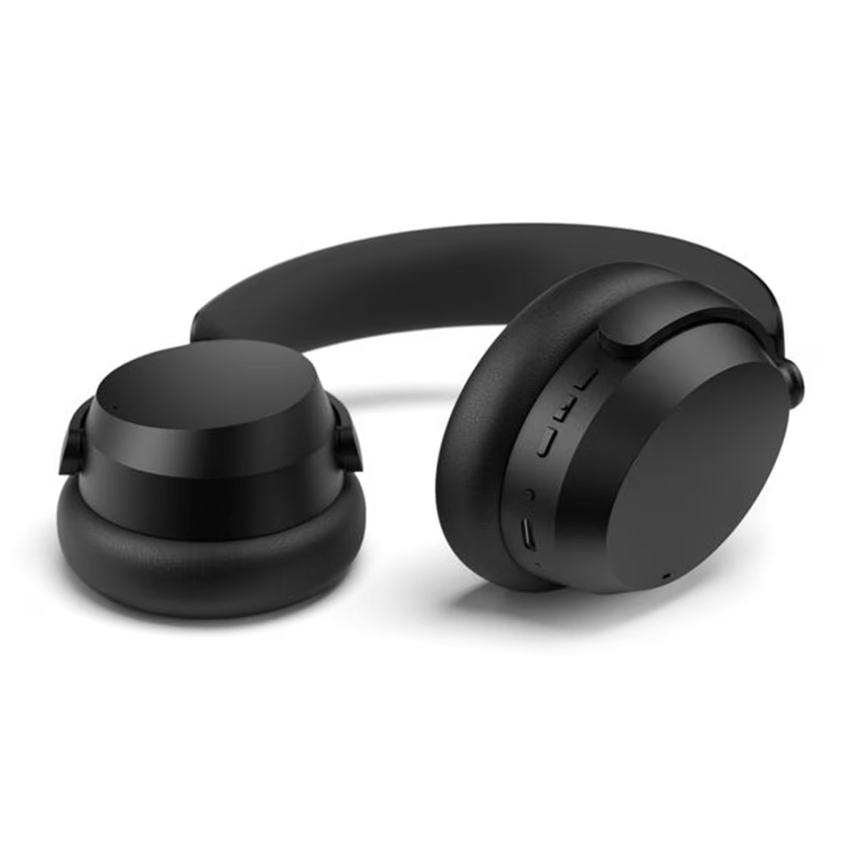 Auriculares negros sobre una superficie blanca.