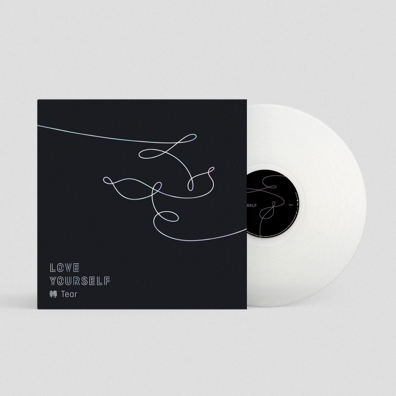 Vinyl album borító fekete háttérrel és fehér vonalrajzzal. A vinyl fehér.