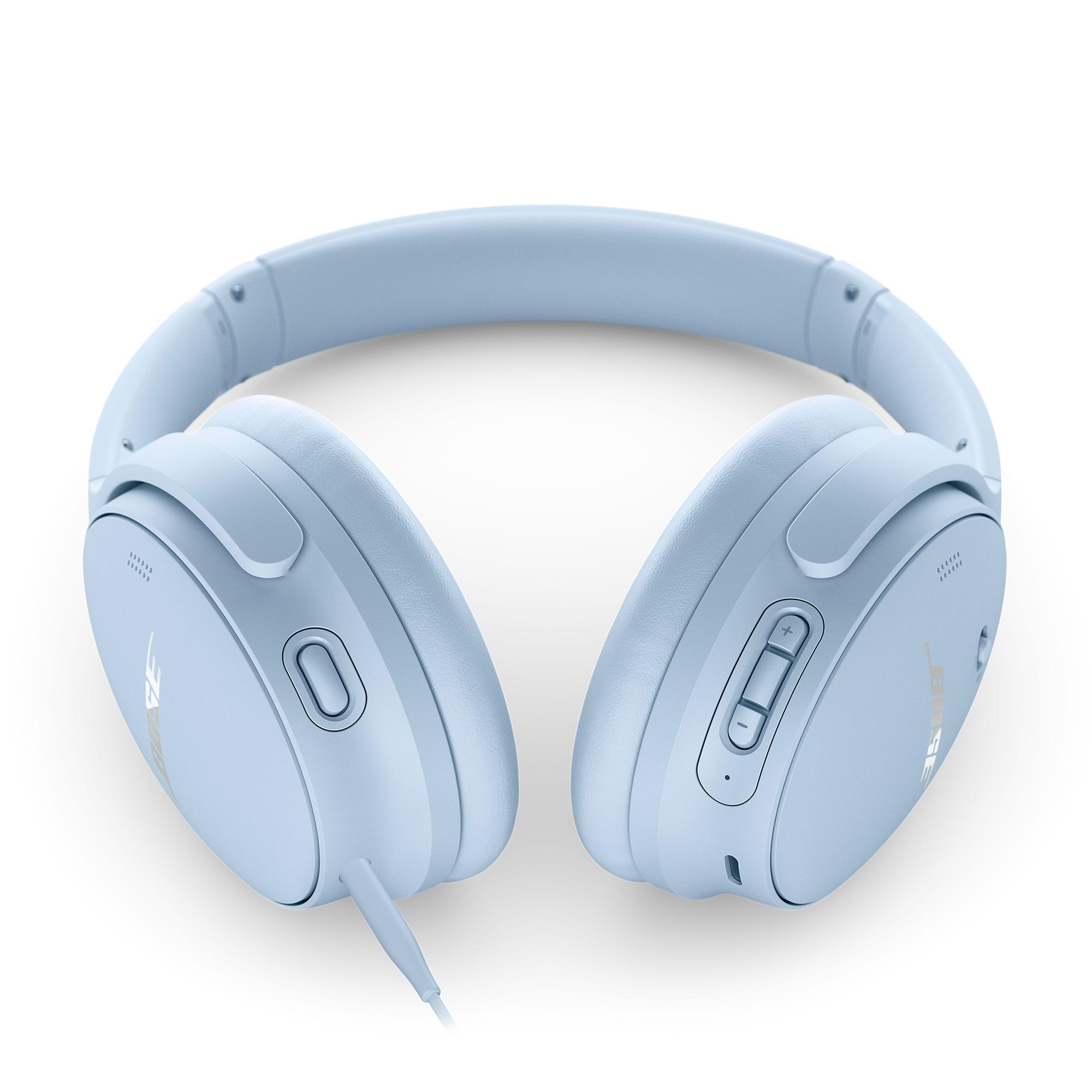 Blaue Over-Ear-Kopfhörer liegen auf einer weißen Oberfläche und zeigen die Ohrmuscheln und das Kopfband.
