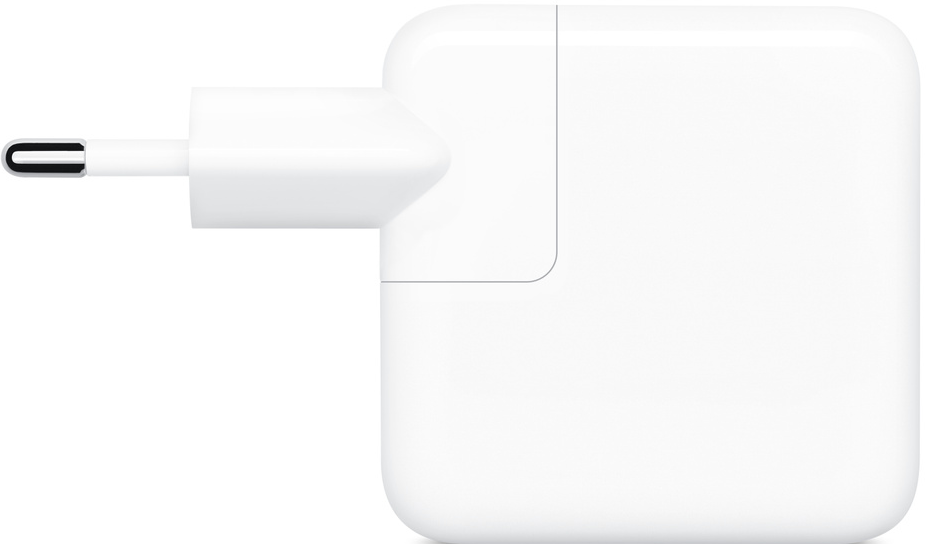 Un adaptateur secteur Apple blanc avec une prise.