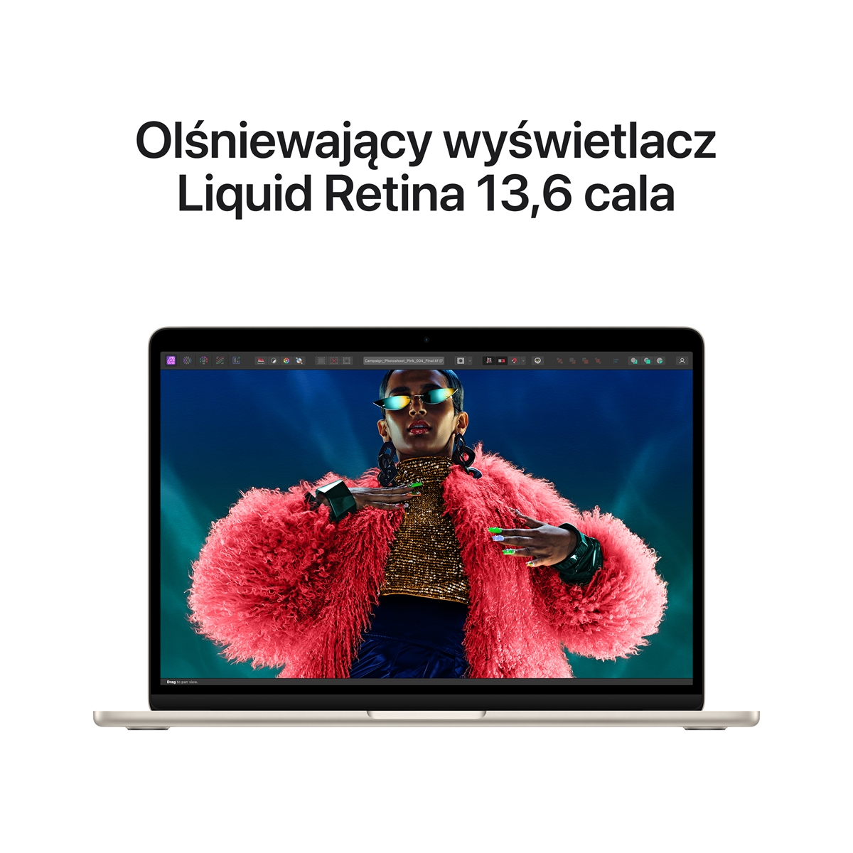 Srebrny laptop wyświetlający kolorowy obraz. Białe tło. Tekst powyżej.