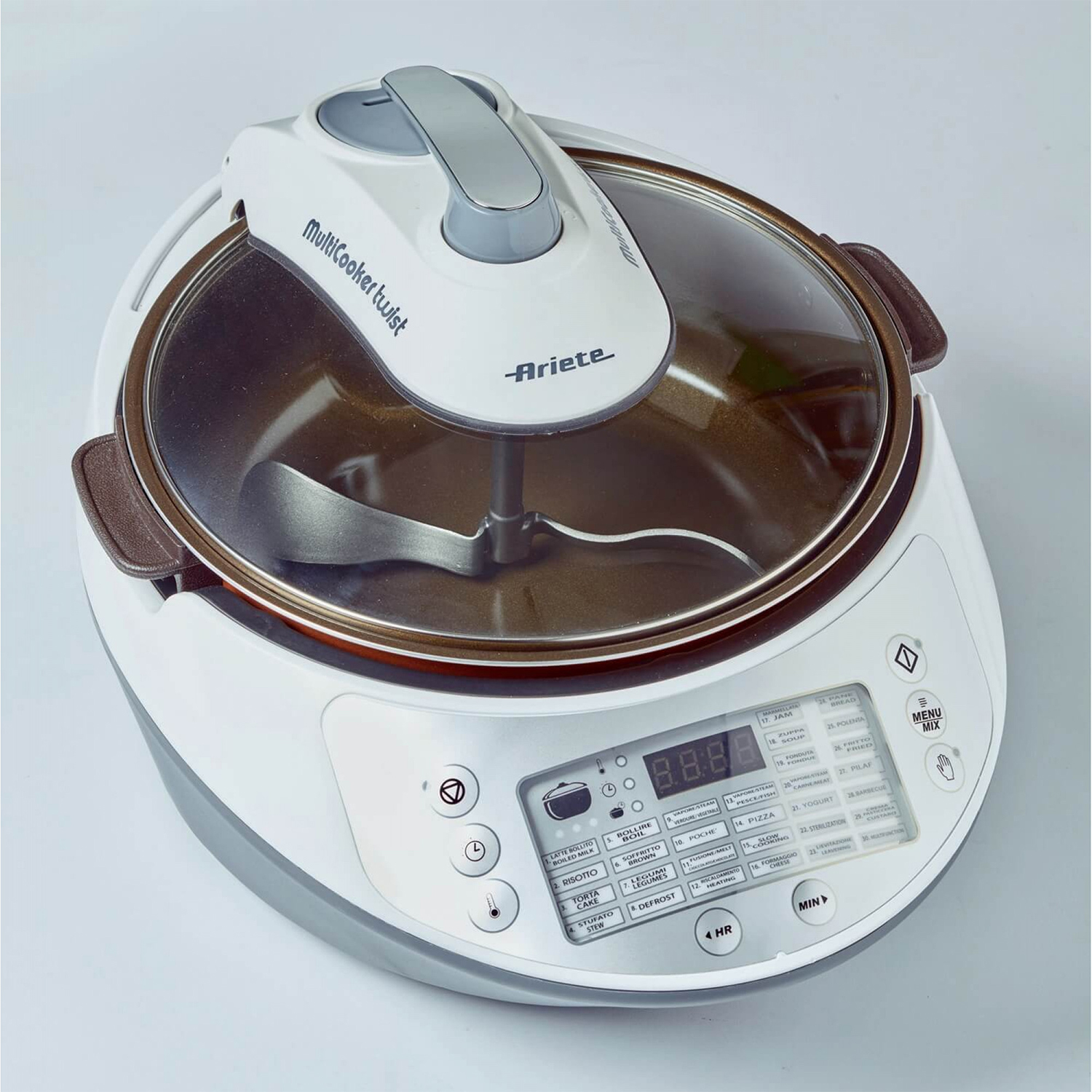 Multicooker bianco e grigio con coperchio trasparente, cucchiaio e display digitale, vista dall'alto.