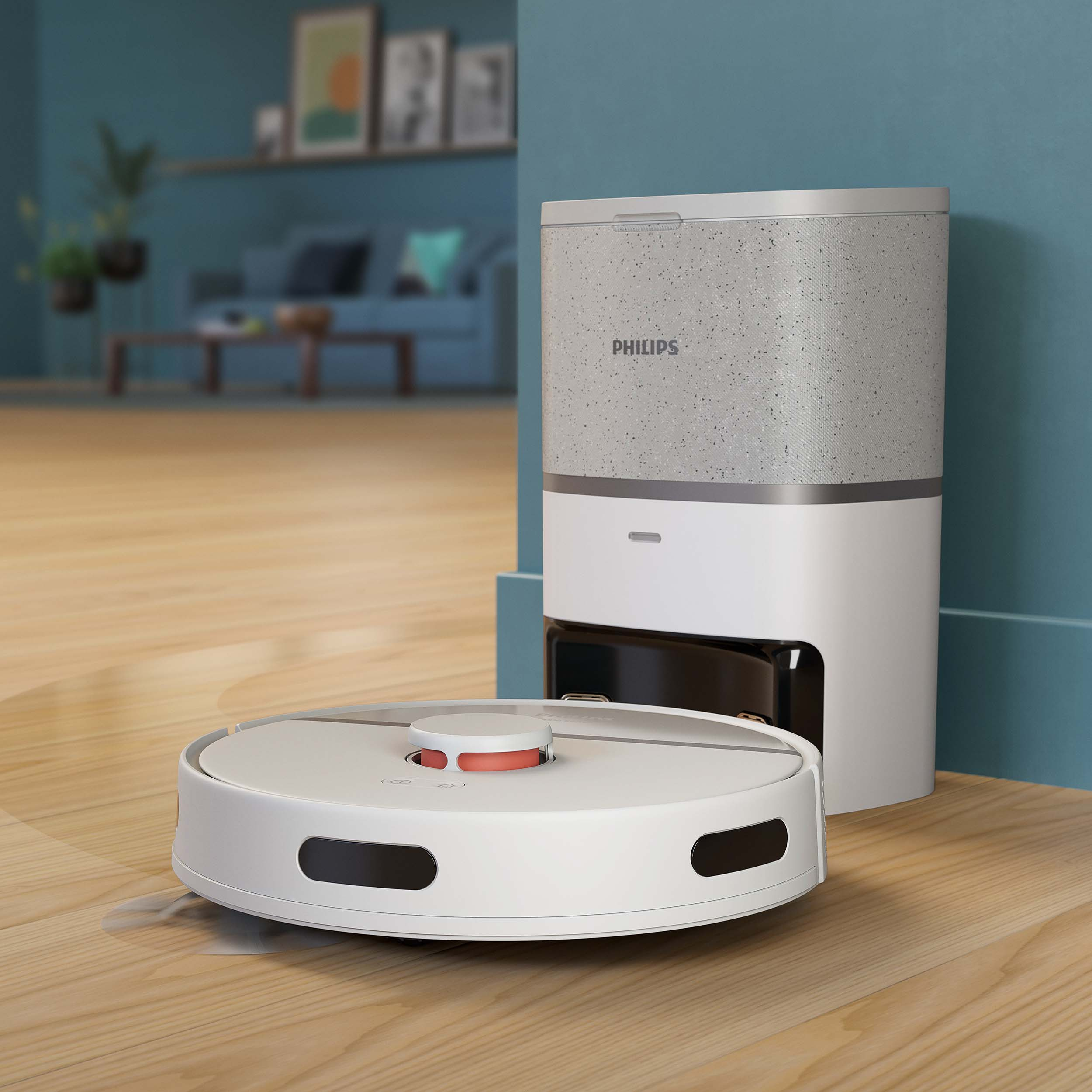 Biały odkurzacz robot Philips i jego stacja ładująca na drewnianej podłodze.
