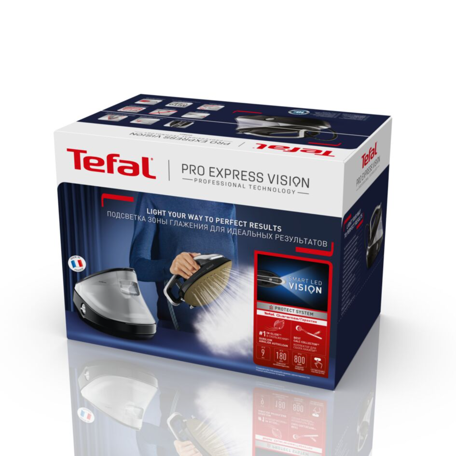 Tefal Pro Express Vision iron box with light, and an iron, reflecting on a glossy surface.