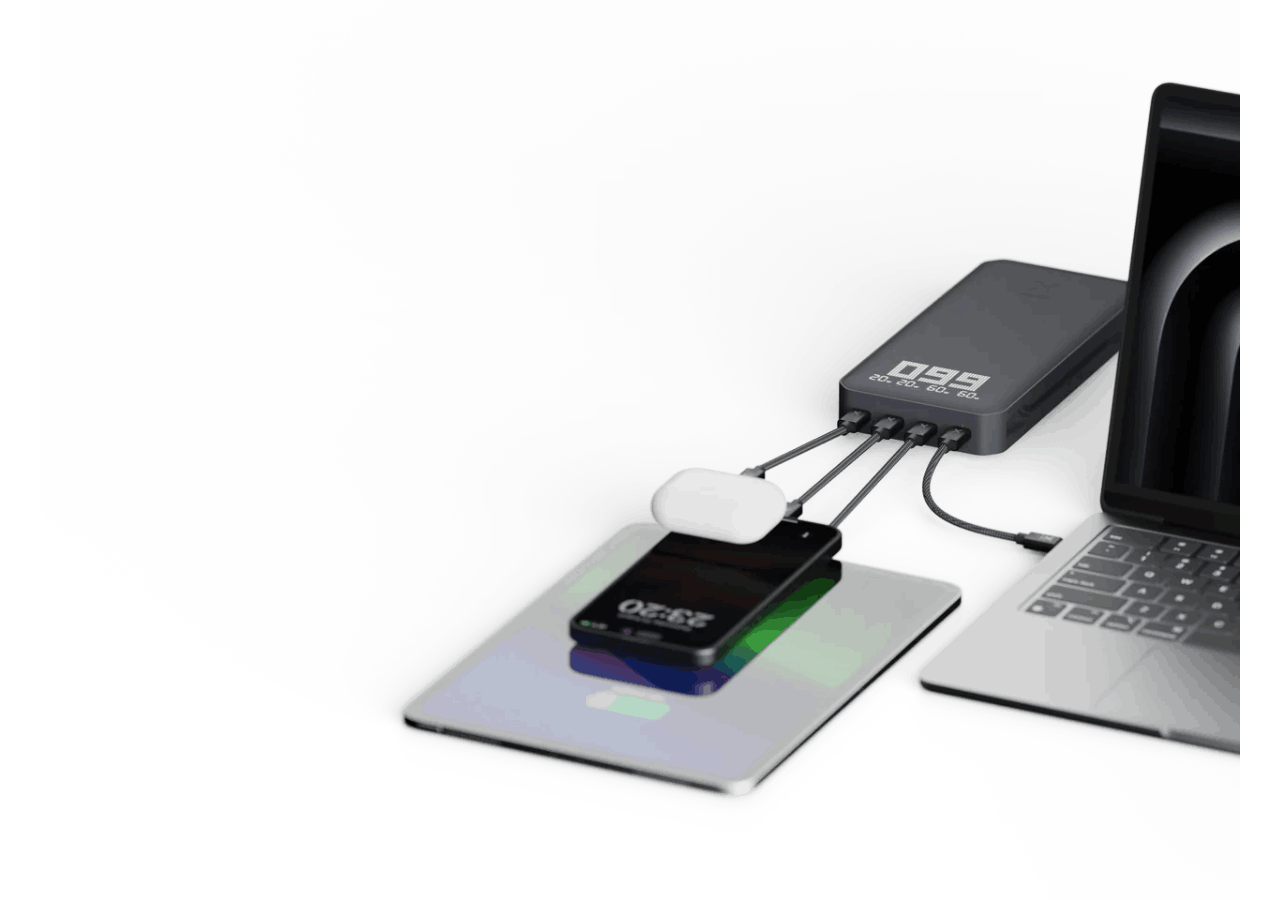 Estación de carga con dispositivos: teléfono, tableta, portátil y auriculares.