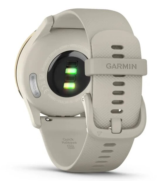 Kremowy smartwatch, widok z tyłu, zielony czujnik tętna świecący, logo Garmin.