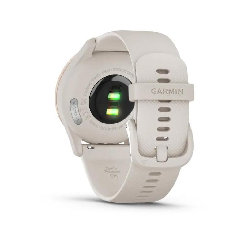 Widok z tyłu smartwatcha Garmin, beżowy pasek, z widocznym czujnikiem tętna.