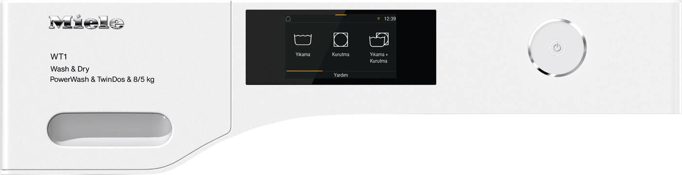 Beyaz çamaşır makinesi paneli, yıkama seçeneklerini gösteren bir ekran ve gümüş renkli bir kontrol kadranı.