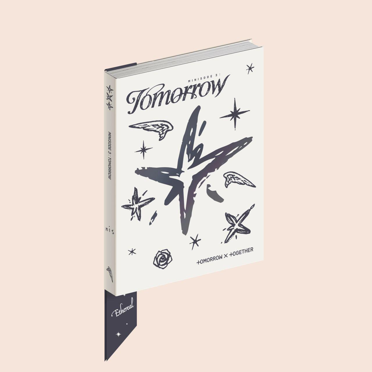 Couverture de livre avec 'Tomorrow' et un motif en forme d'étoile, un marque-page.