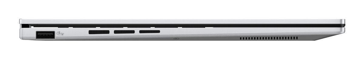 Smukły srebrny laptop widziany z boku, pokazujący porty i otwory wentylacyjne.