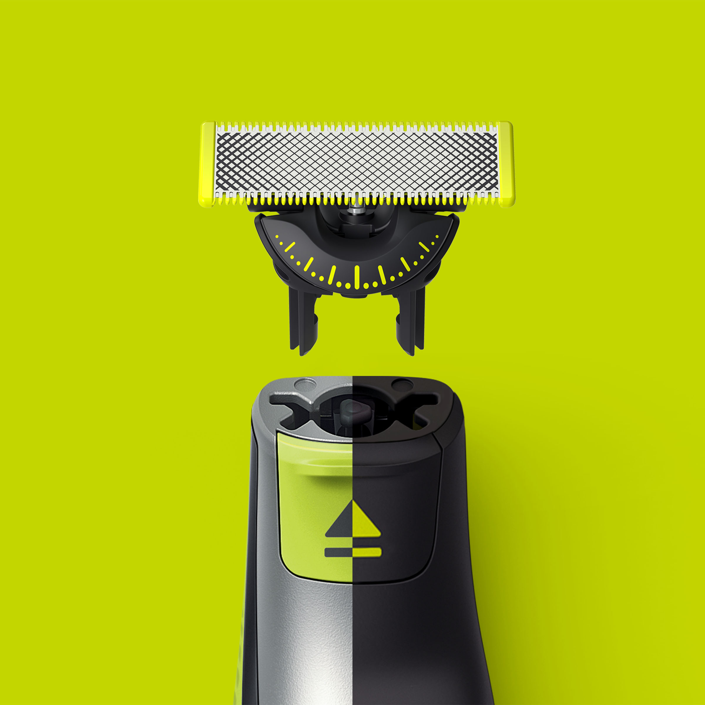 Czarno-żółty Philips OneBlade z odłączonym ostrzem, na zielonym tle.