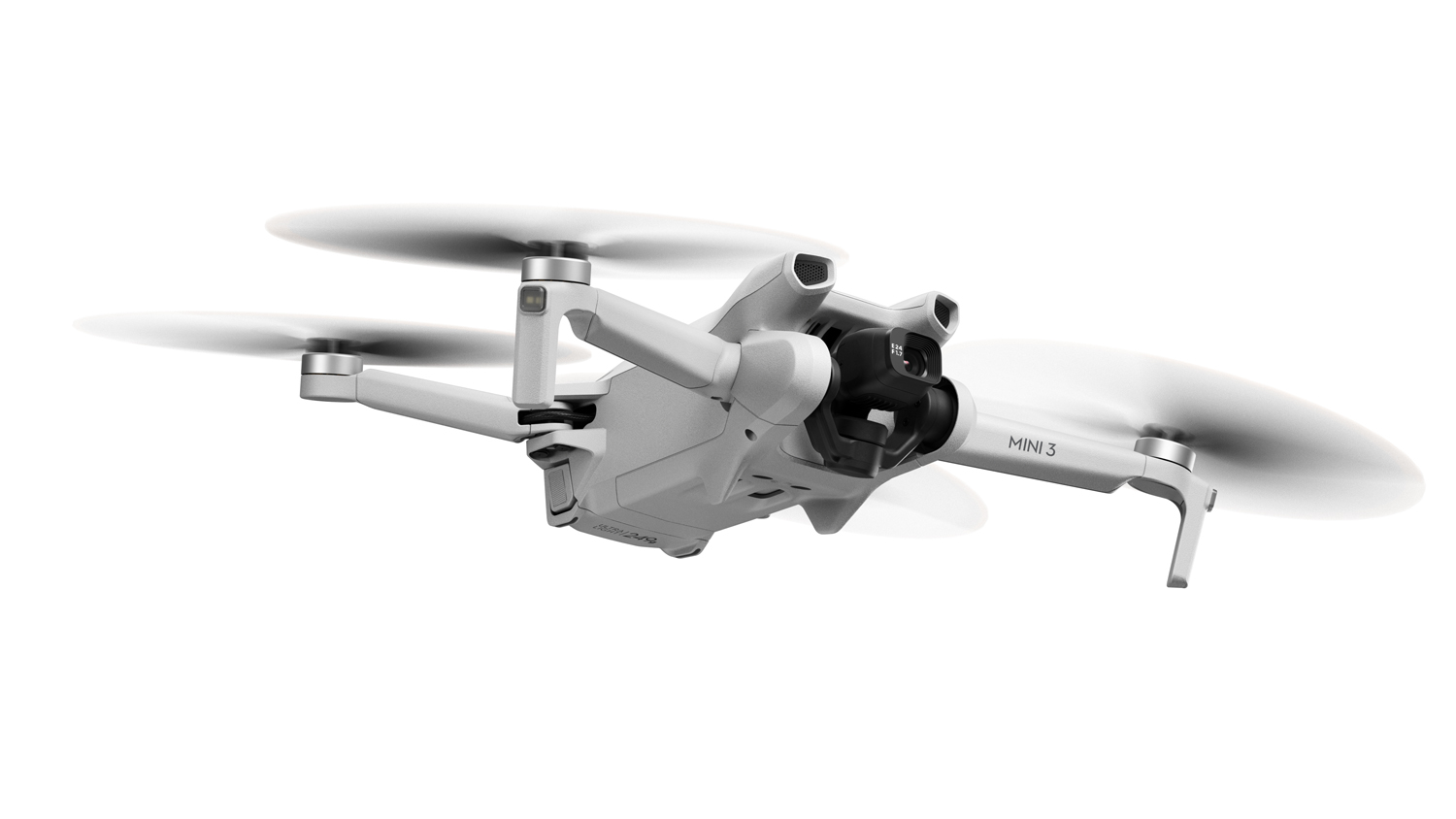 Havada dönen pervaneleri olan beyaz bir drone.