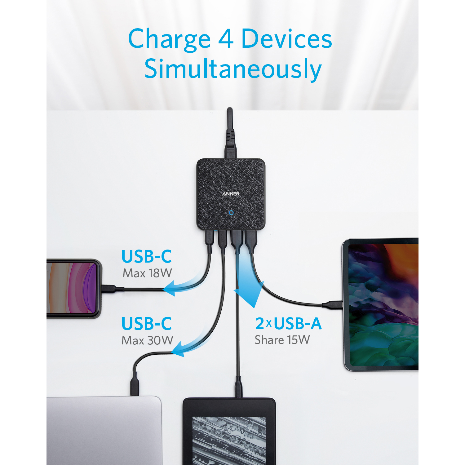 Black charging station with USB-C and USB-A ports, charging multiple devices.