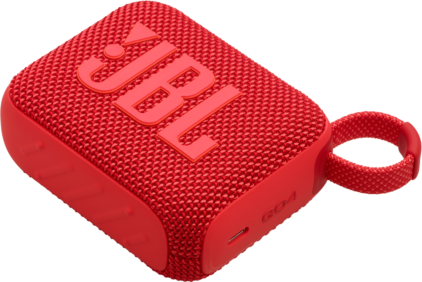 Un haut-parleur JBL Go 4 rouge, avec une sangle rouge. Le haut-parleur a le logo JBL.