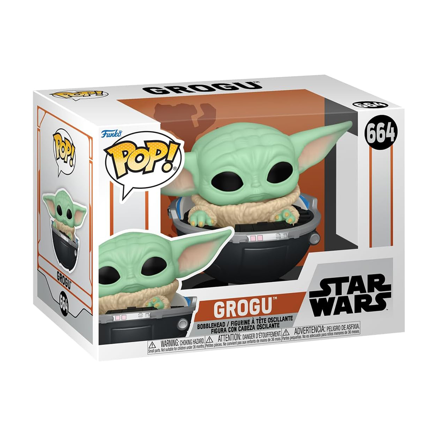 Una figura di Grogu in una scatola. La figura è in una capsula nera con la pelle verde chiaro.