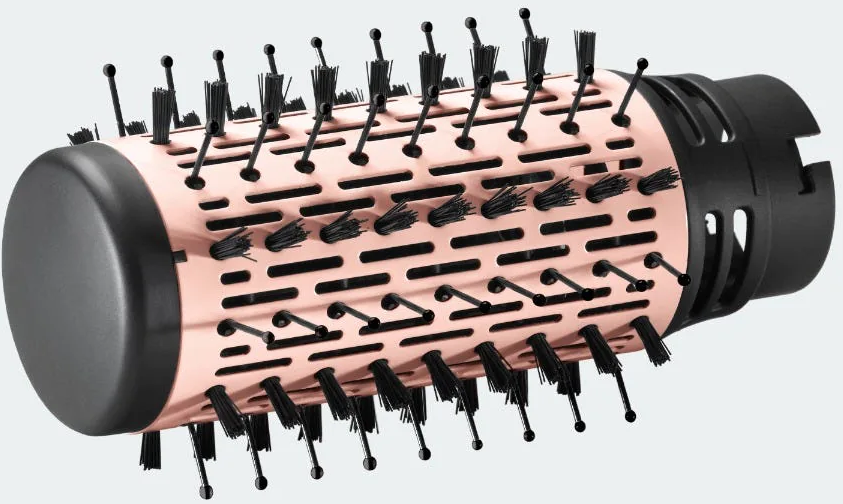 Una spazzola per capelli color oro rosa con setole nere.