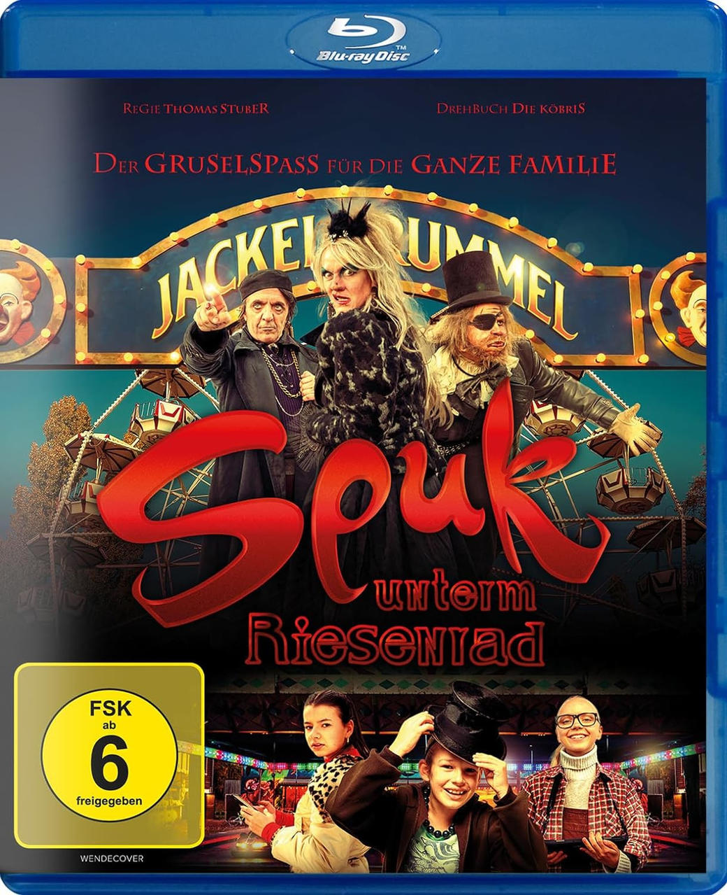 DVD-Cover von 'Spuk unterm Riesenrad'. Eine Gruppe von Leuten auf blauem Hintergrund mit Text.