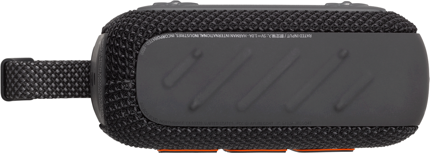 Un haut-parleur noir avec une surface texturée. La base est noire et il y a un point d'attache de la sangle.
