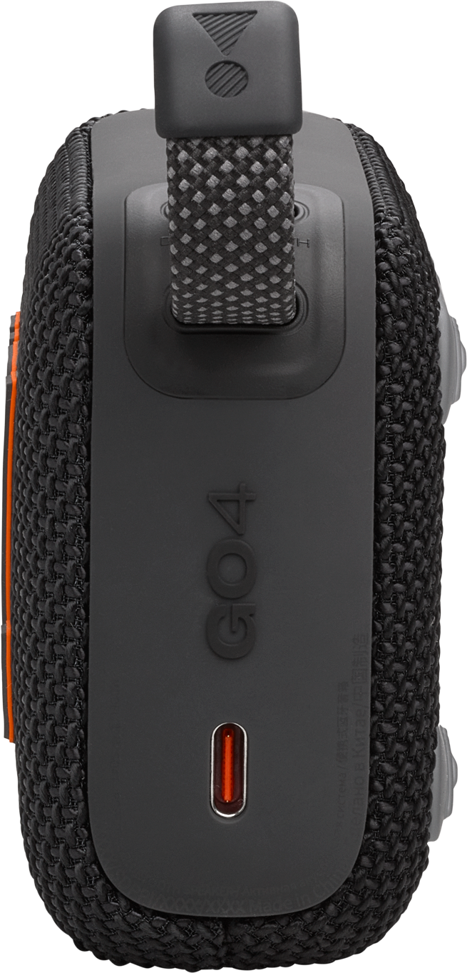 Un petit haut-parleur JBL noir avec un motif camouflage, des touches d'orange et une poignée.