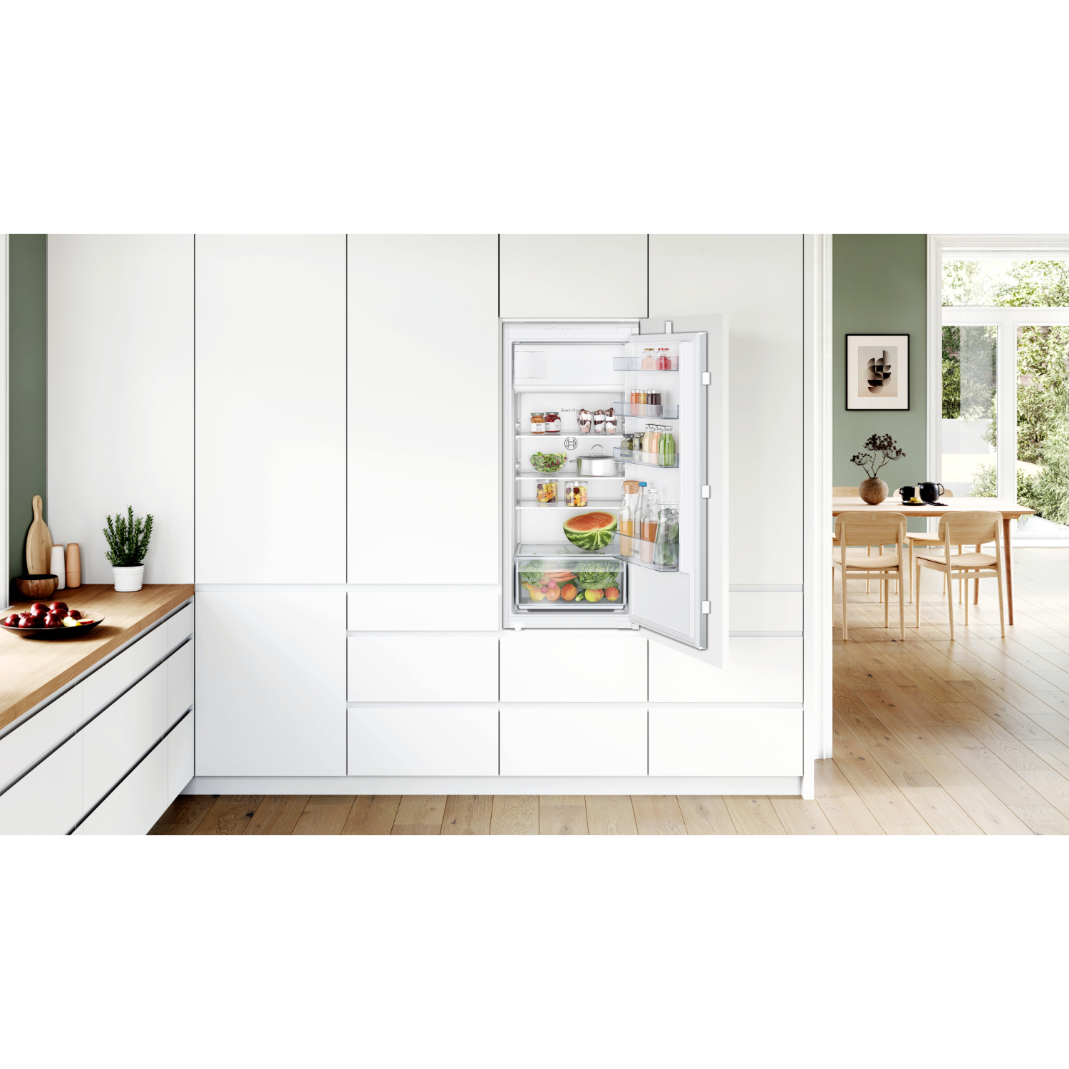 Open white refrigerator with food inside, on wooden surface.