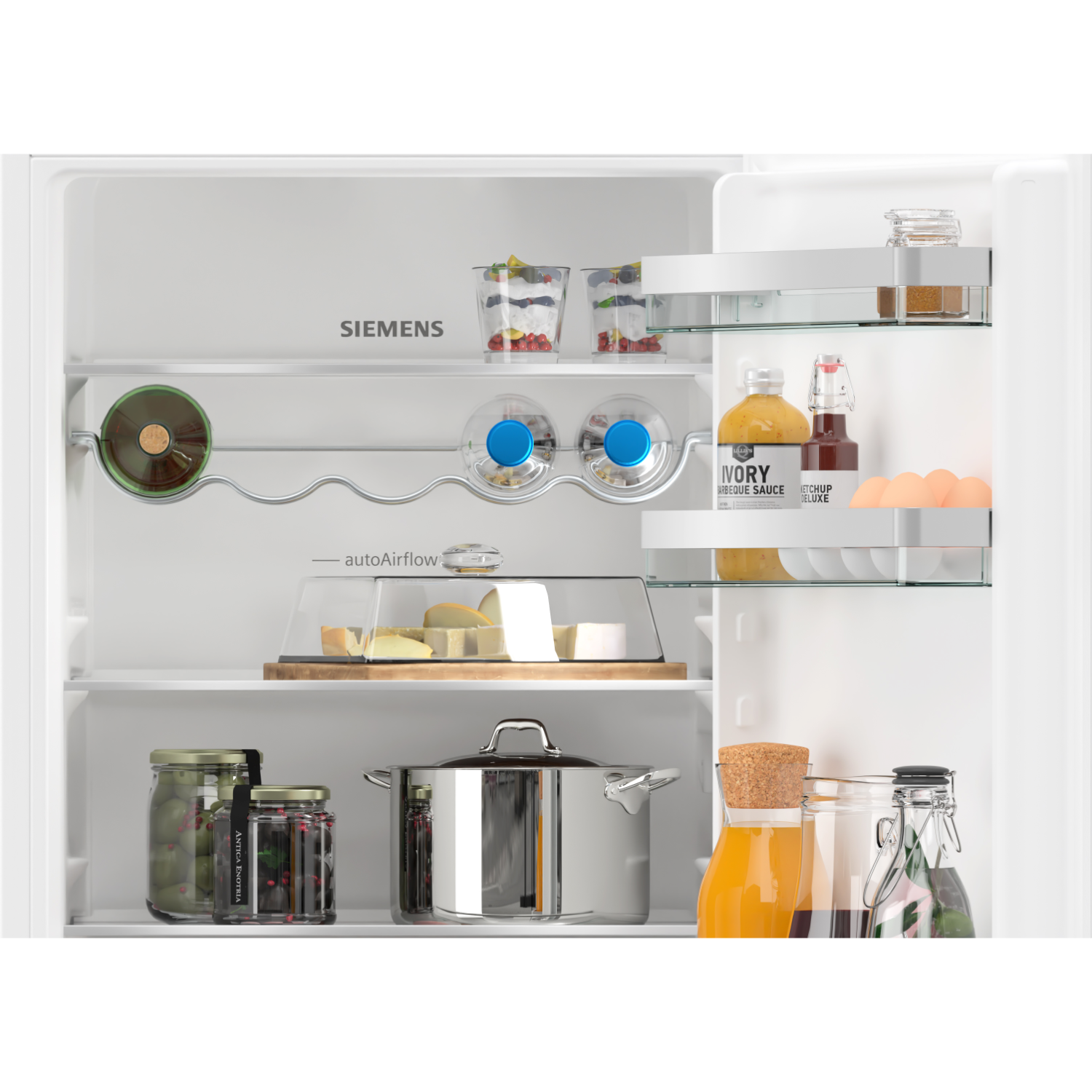 Open refrigerator interior. Contains shelves with food items like jars, eggs, and bottles.