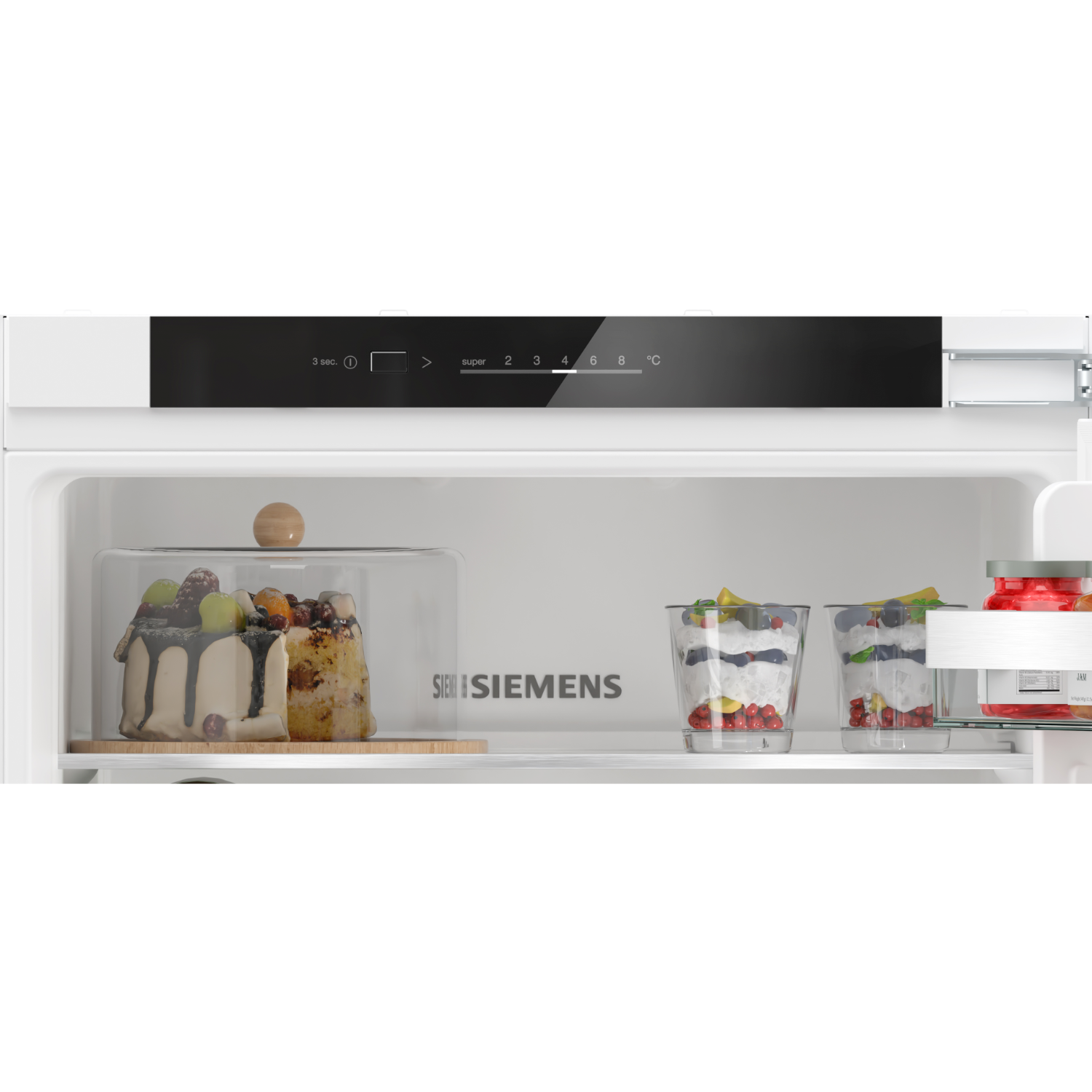 Fridge interior with desserts. Cake with fruit, layered desserts in glasses.