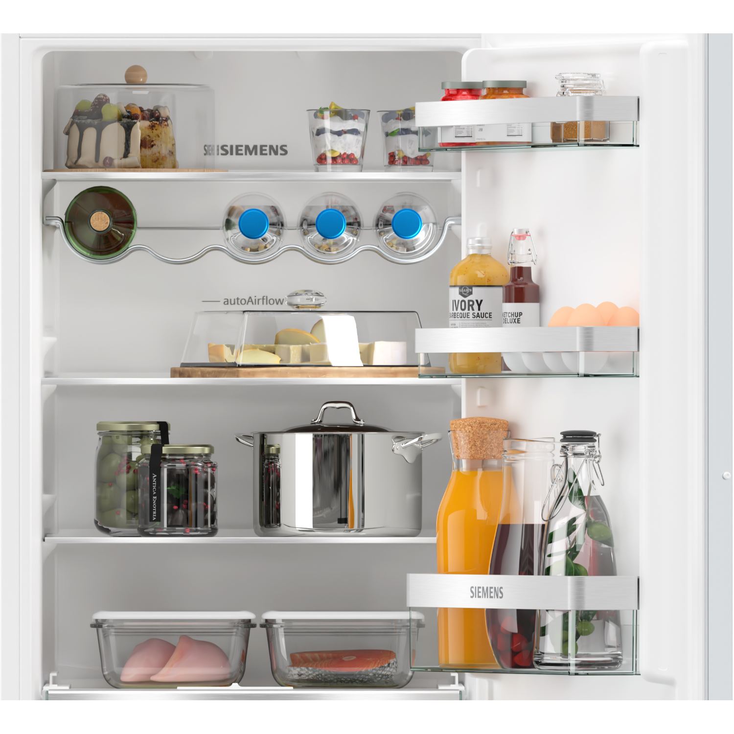 Open refrigerator interior with various food items, including cheese, jars, and drinks.