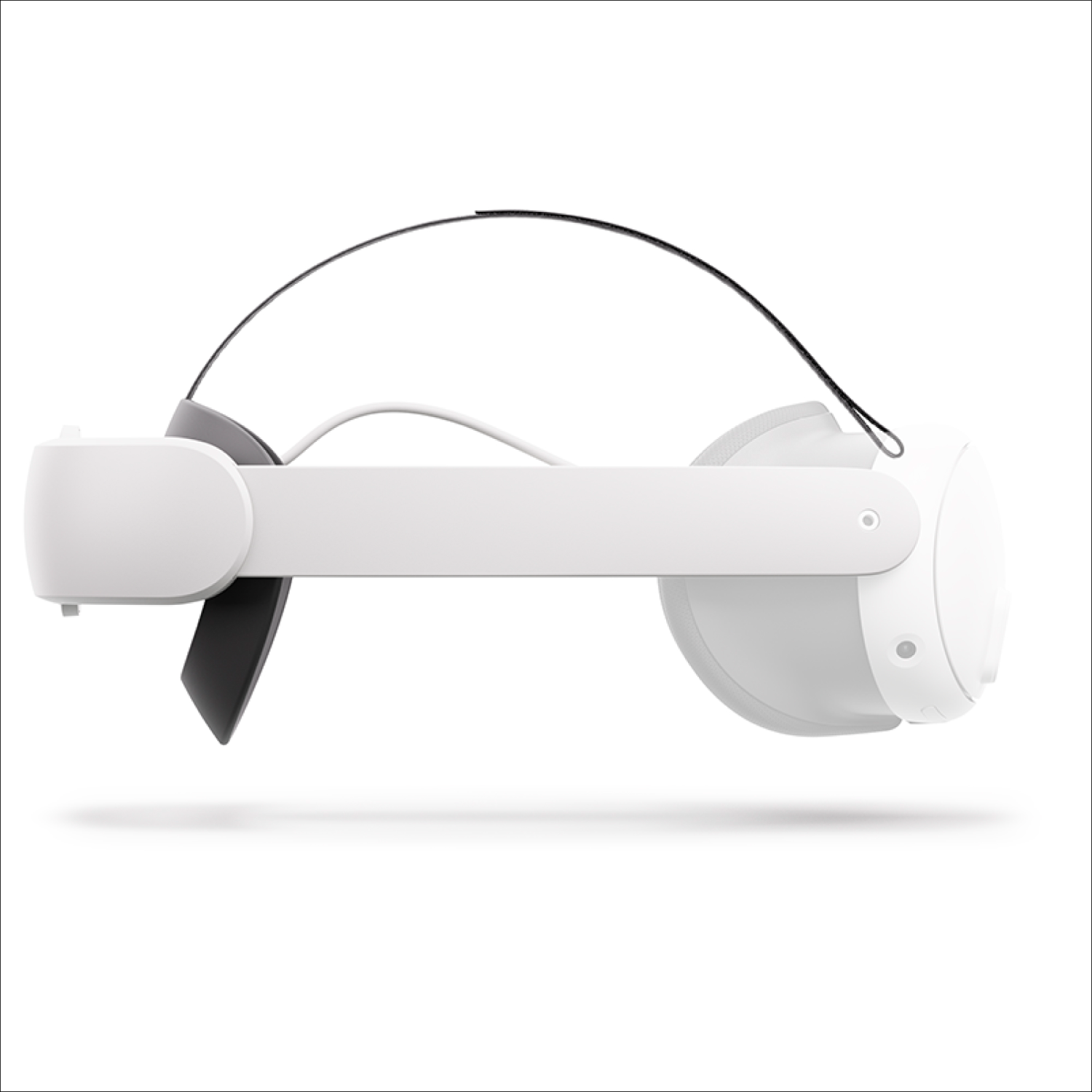 White VR headset, side view, with a black strap, and a white head strap.