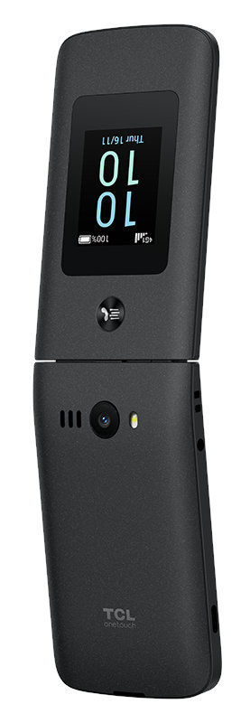 Czarny telefon z klapką, otwarty. Wyświetla datę, godzinę i poziom naładowania baterii. Białe tło.