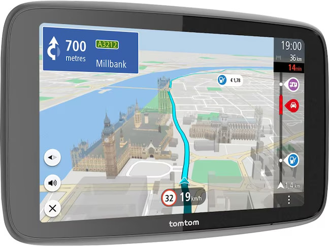 A TomTom GPS device displaying a navigation map with a route and buildings.