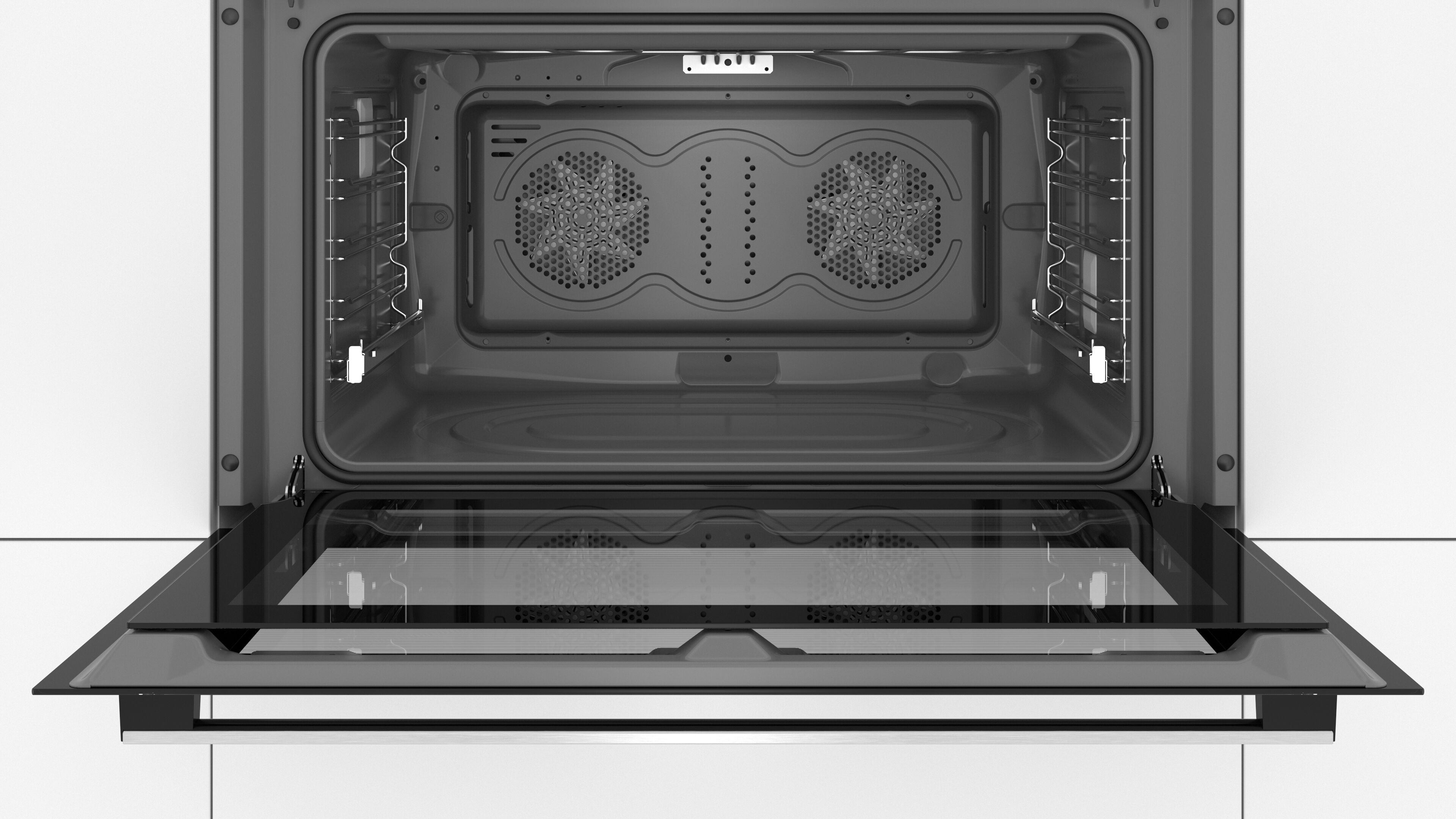 Un horno abierto con la puerta abajo, mostrando detalles interiores.