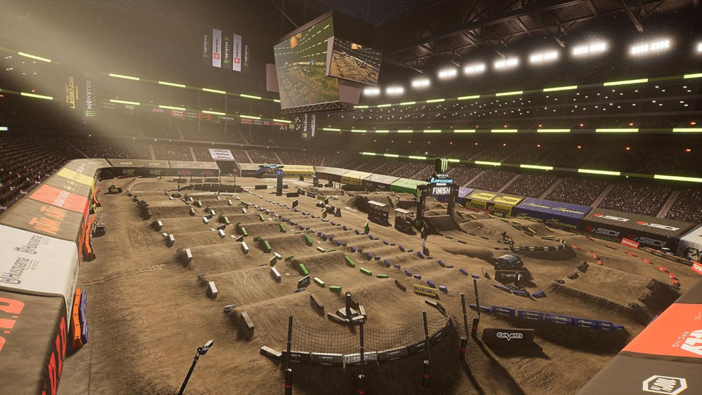 Indoor motorcross stadion scène. Dirt track met sprongen, obstakels en tribune.