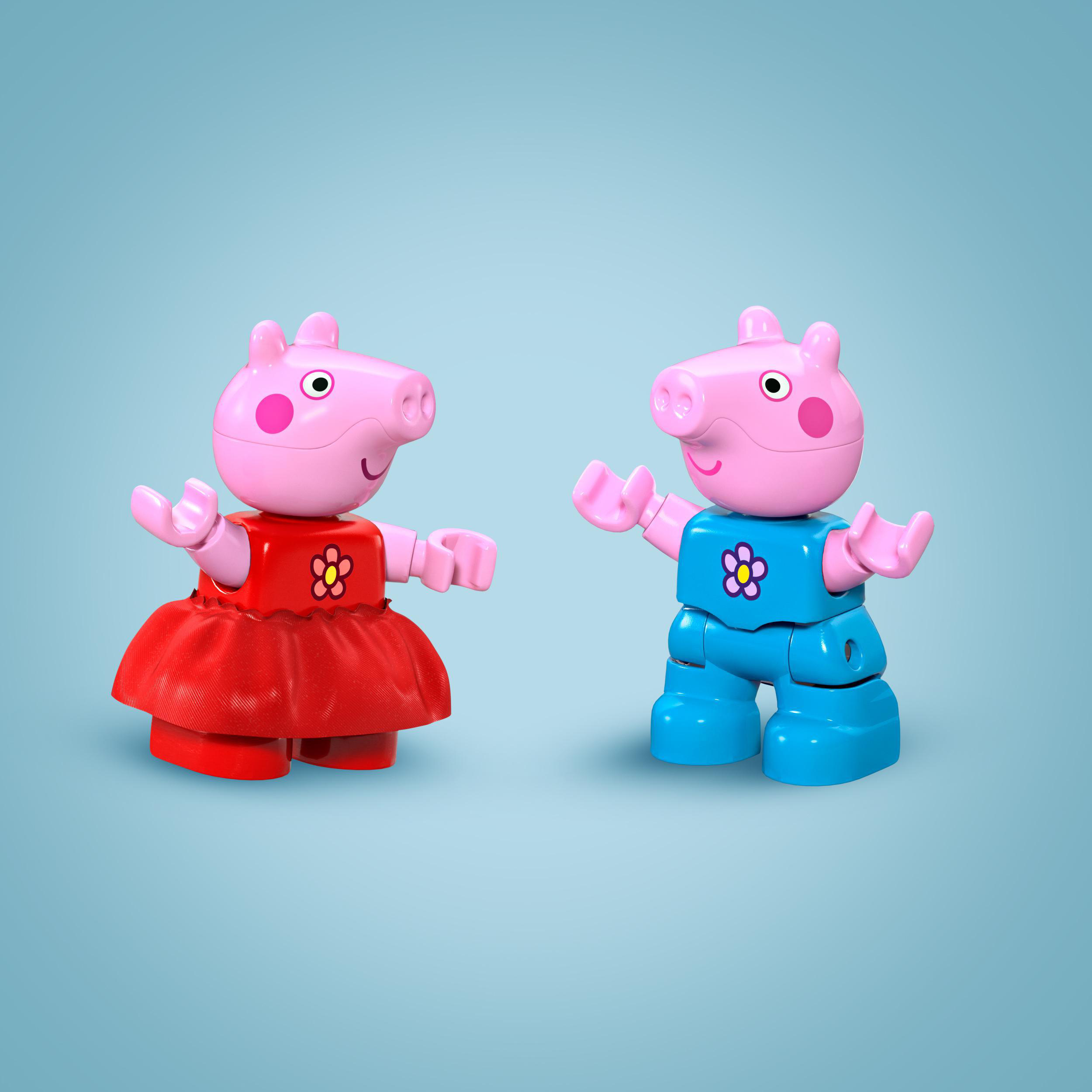 Zwei Peppa Wutz Figuren, eine in rotem Kleid, die andere in blauen Overalls, auf blauem Hintergrund.
