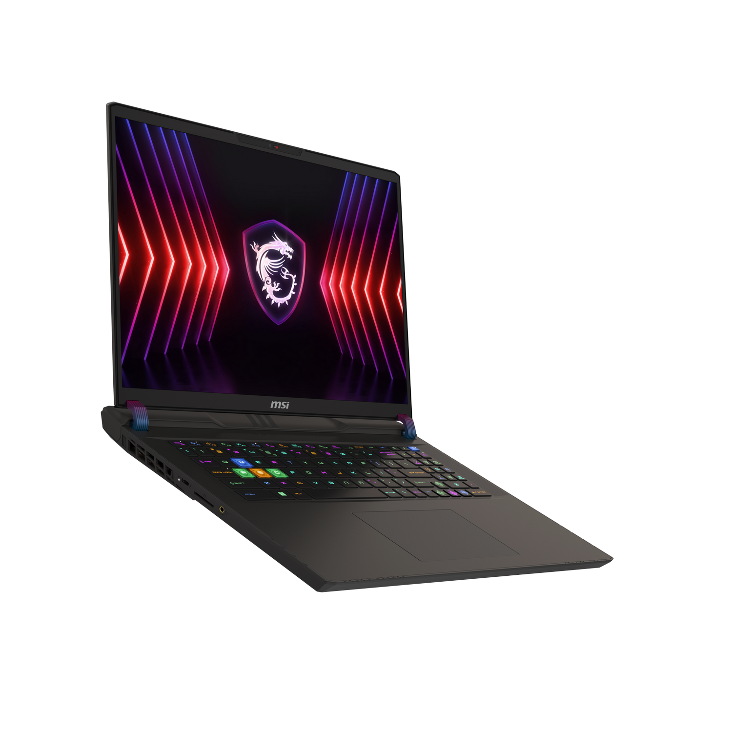 Portátil gaming negro sobre una superficie oscura con teclado y pantalla coloridos.