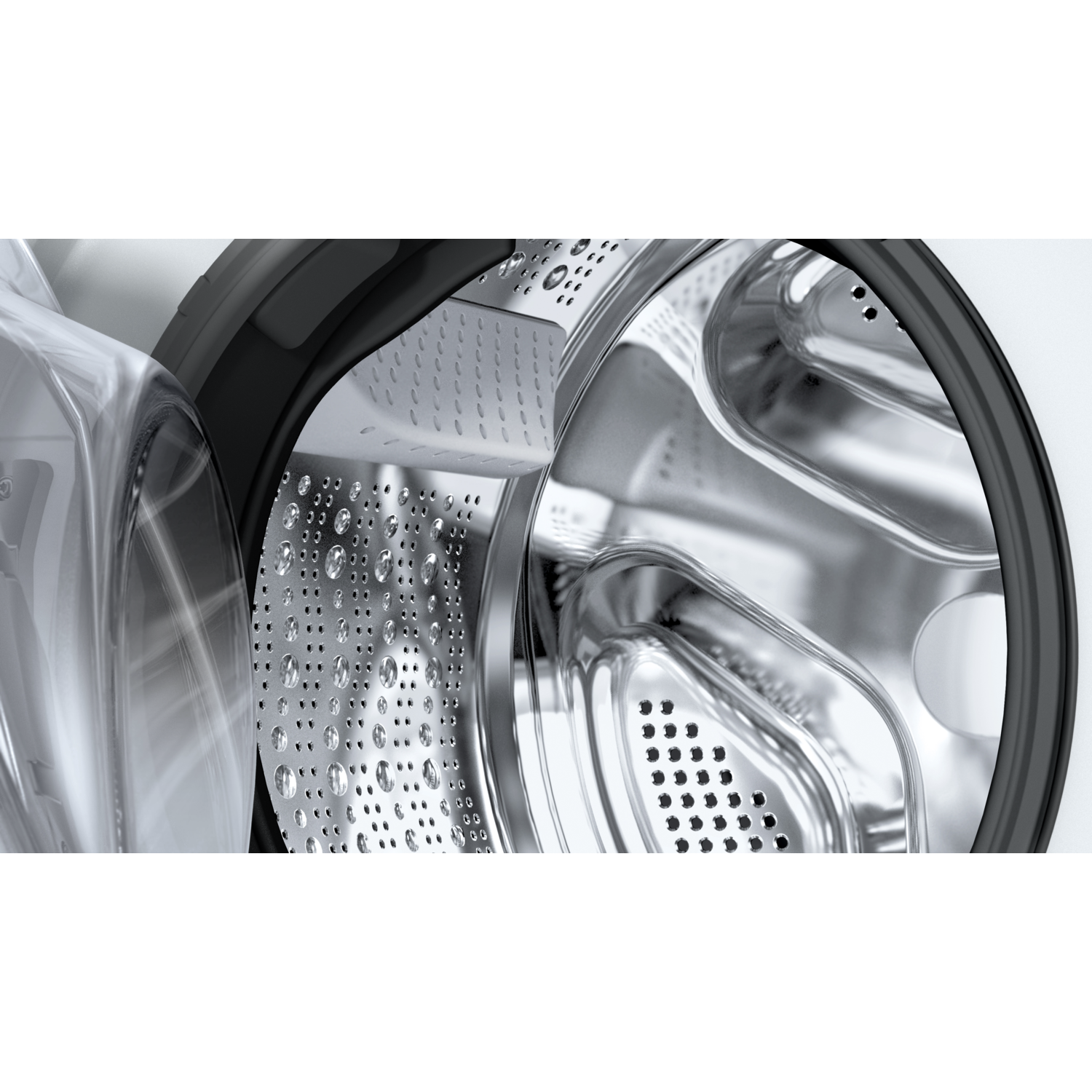 Close-up of a washing machine drum with water droplets.