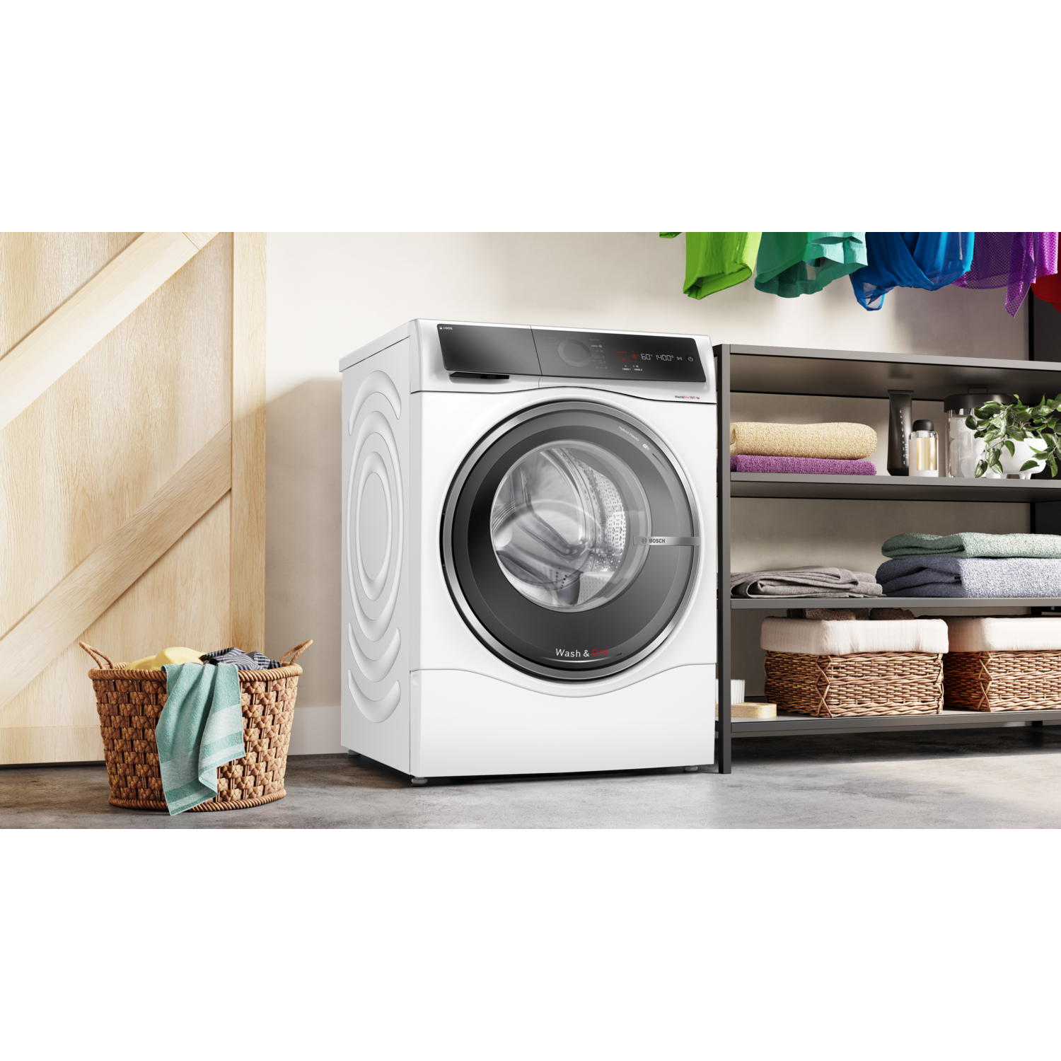 White washing machine next to a gray shelf with baskets. Laundry is in a basket.