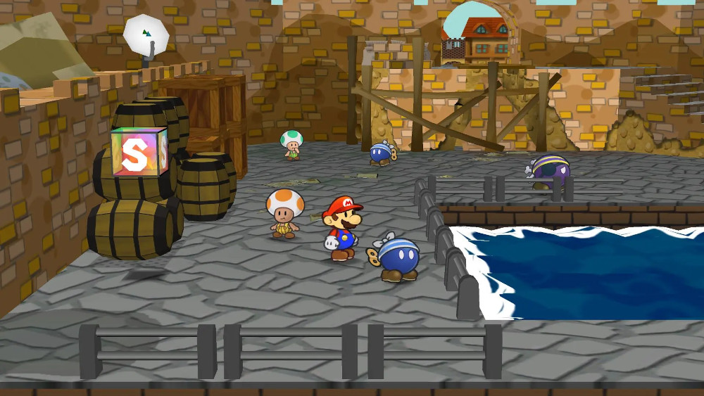 Een videogame scène met Mario, Toads en vijanden in de buurt van water en gebouwen.