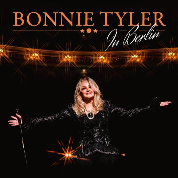 Albumcover: Bonnie Tyler im Konzert, Arme ausgestreckt, auf dunkler Bühne mit Lichtern. Titel oben.